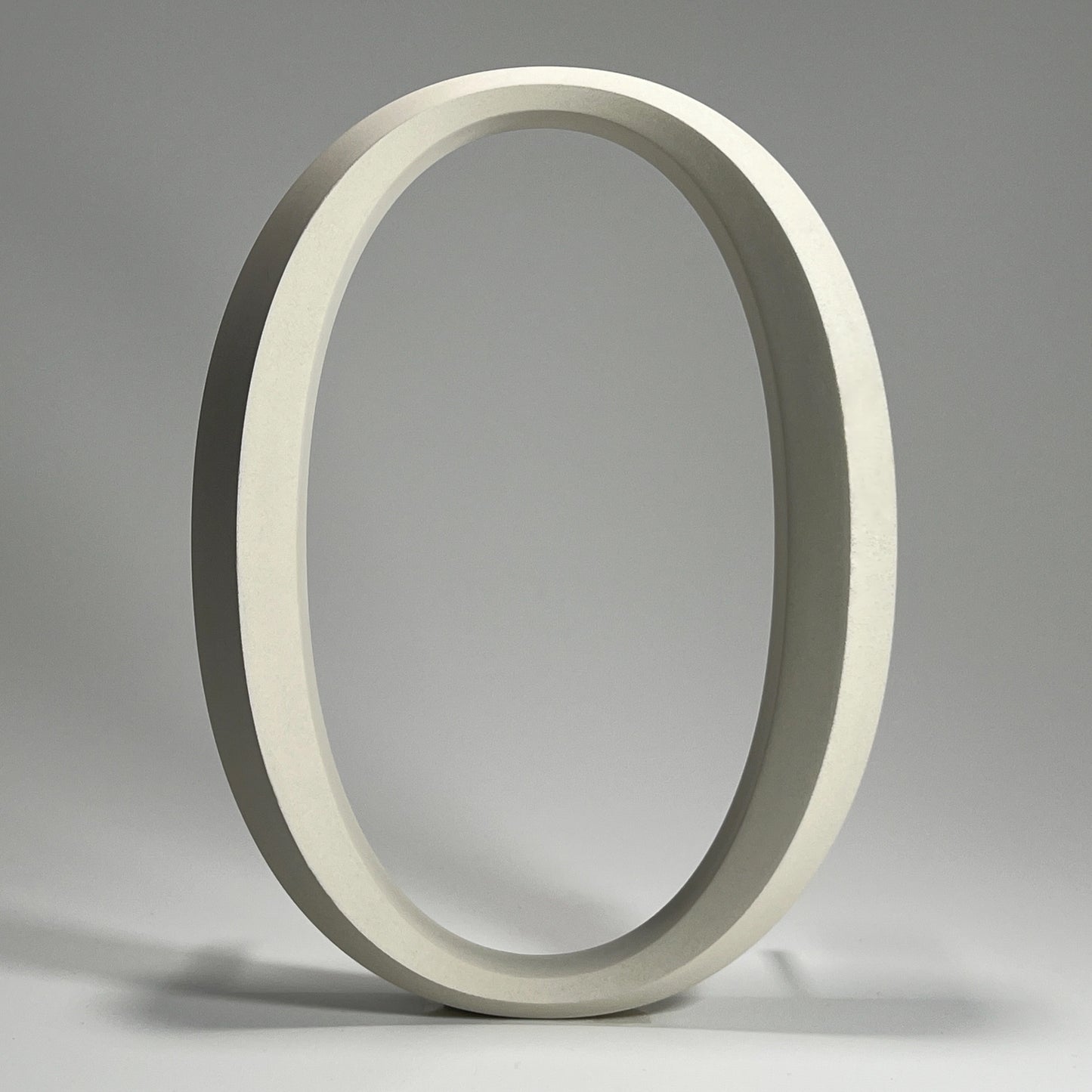 Elegant floating prismatic house number ‘0’, suitable for luxury homes and timeless architectural designs.