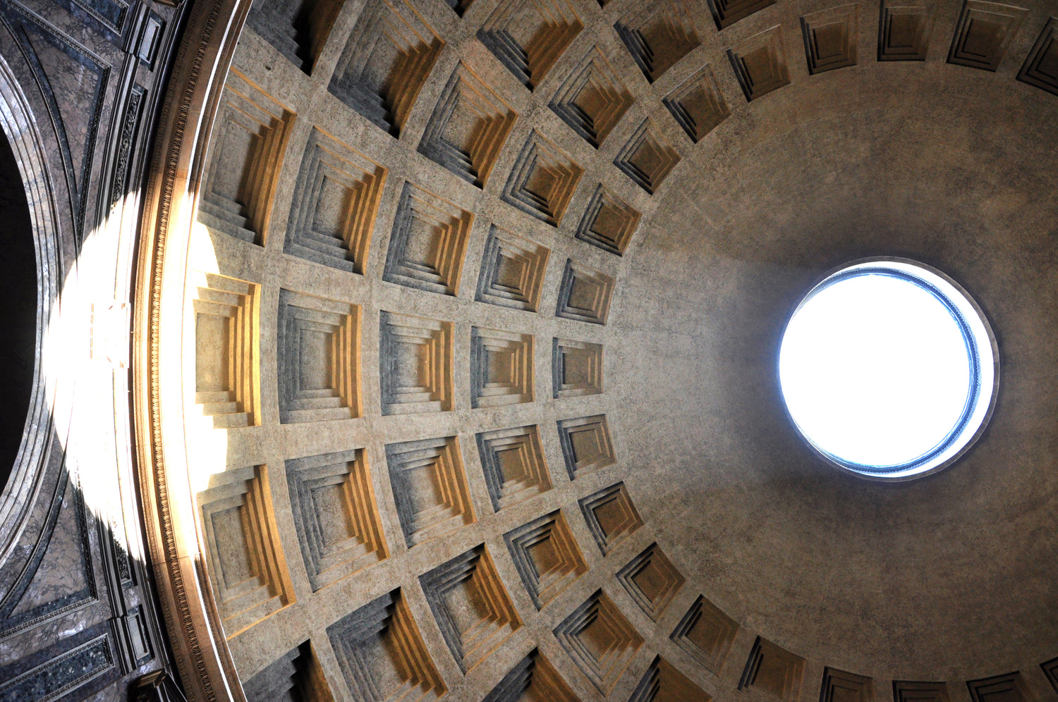 The coffered dome of the Pantheon in Rome, showcasing timeless architectural design and classical craftsmanship. A key inspiration behind our prismatic house numbers, reflecting heritage and precision in cast stone.