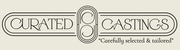 Curated Castings logo - luxury cast stone house numbers and signs.