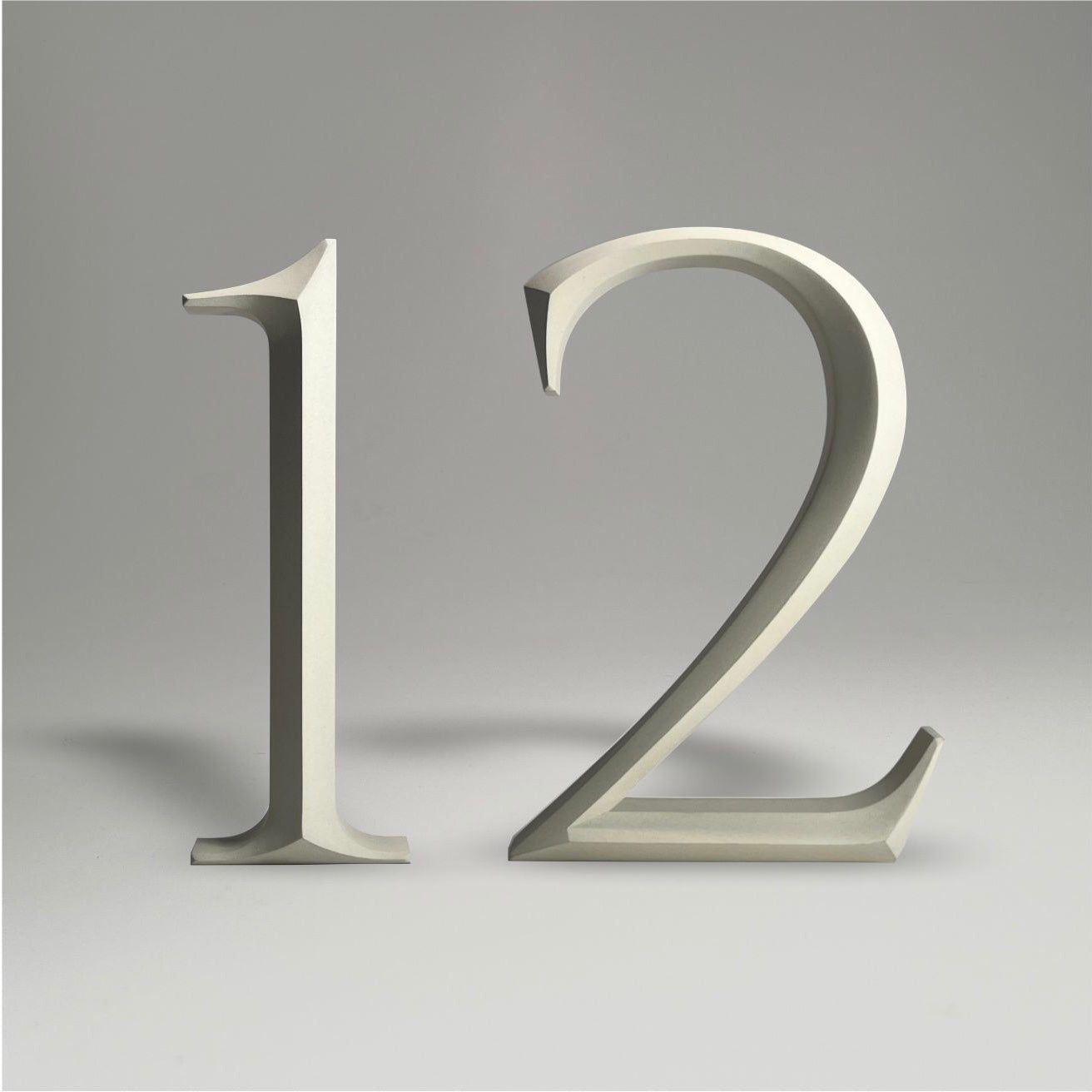 Luxury floating prismatic house number sign ‘12’, ideal for classical houses with timeless appeal.