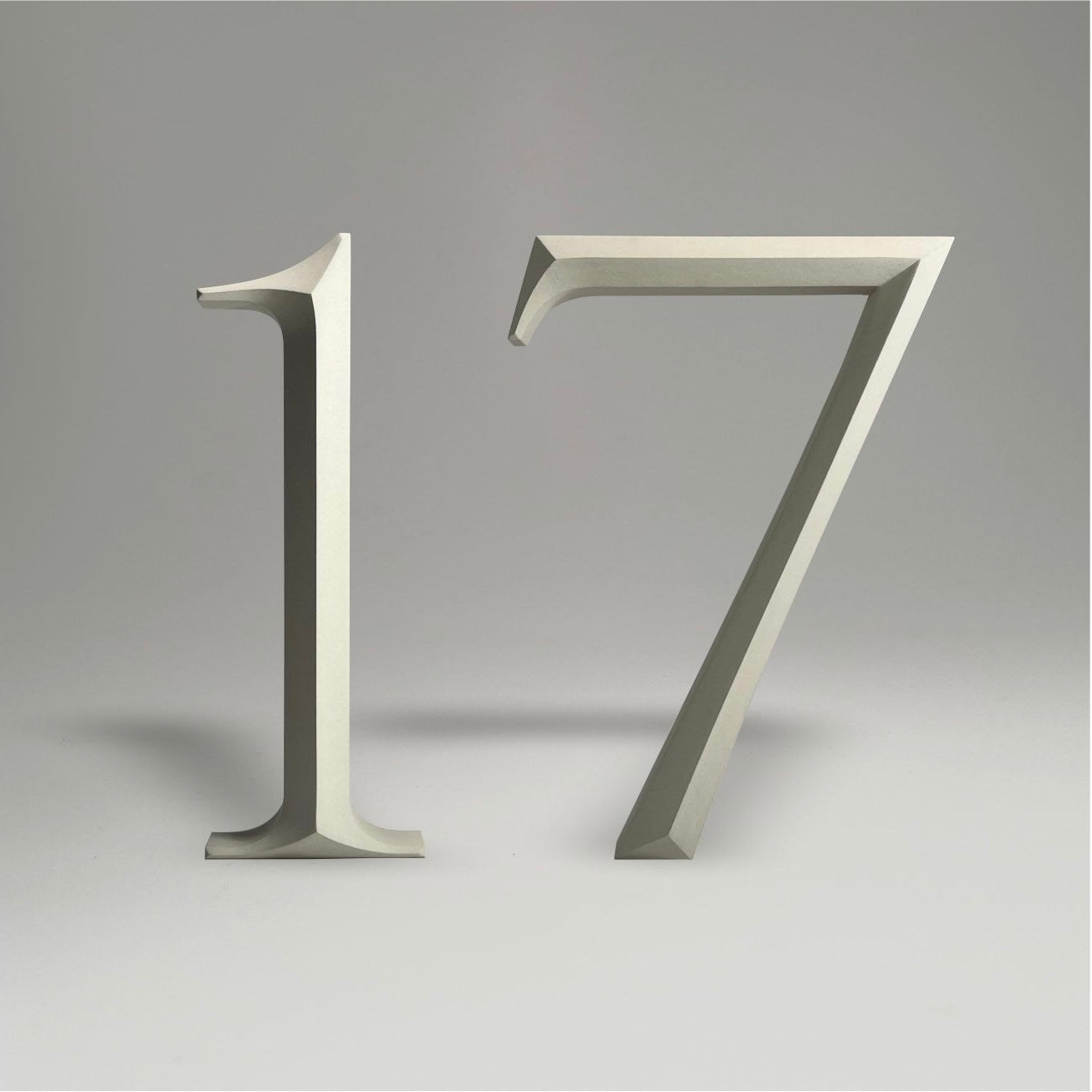 Luxury floating prismatic house number sign ‘17’, ideal for classical houses with timeless appeal.
