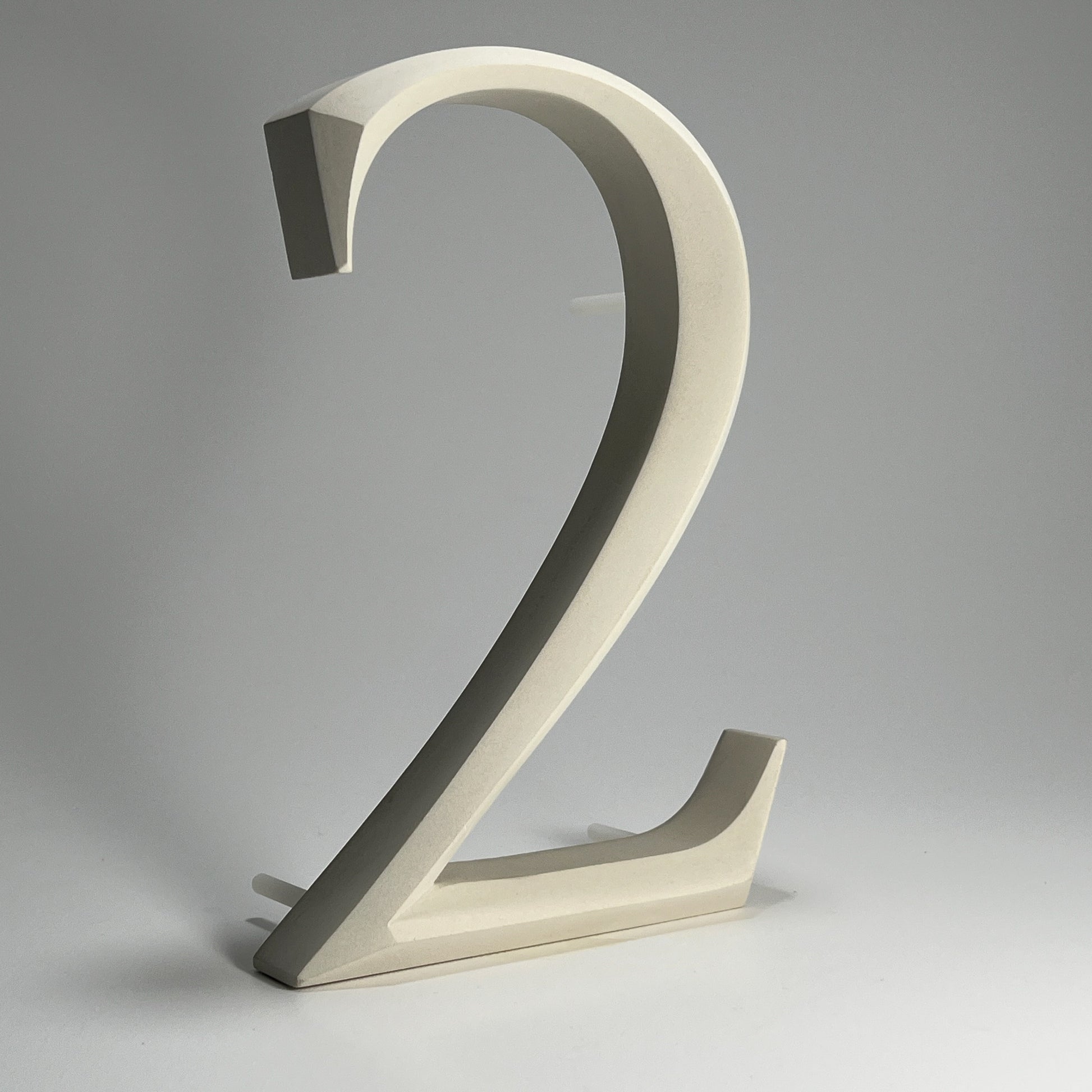 Elegant floating prismatic house number ‘2’, suitable for luxury homes and timeless architectural designs.