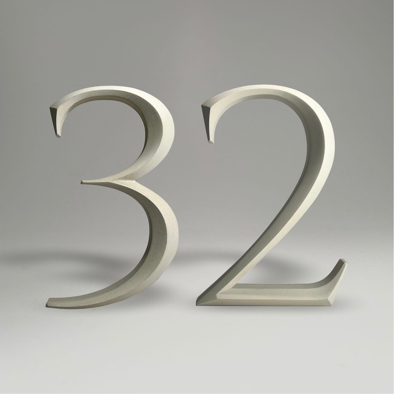 Luxury floating prismatic house number sign ‘32’, ideal for classical houses with timeless appeal.