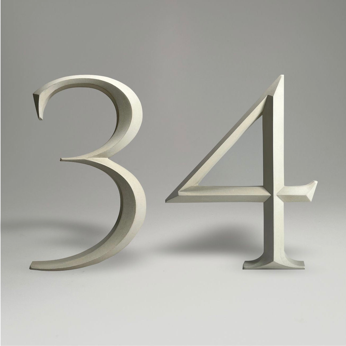 Elegant floating prismatic house number ‘34’, suitable for luxury homes and timeless architectural designs.