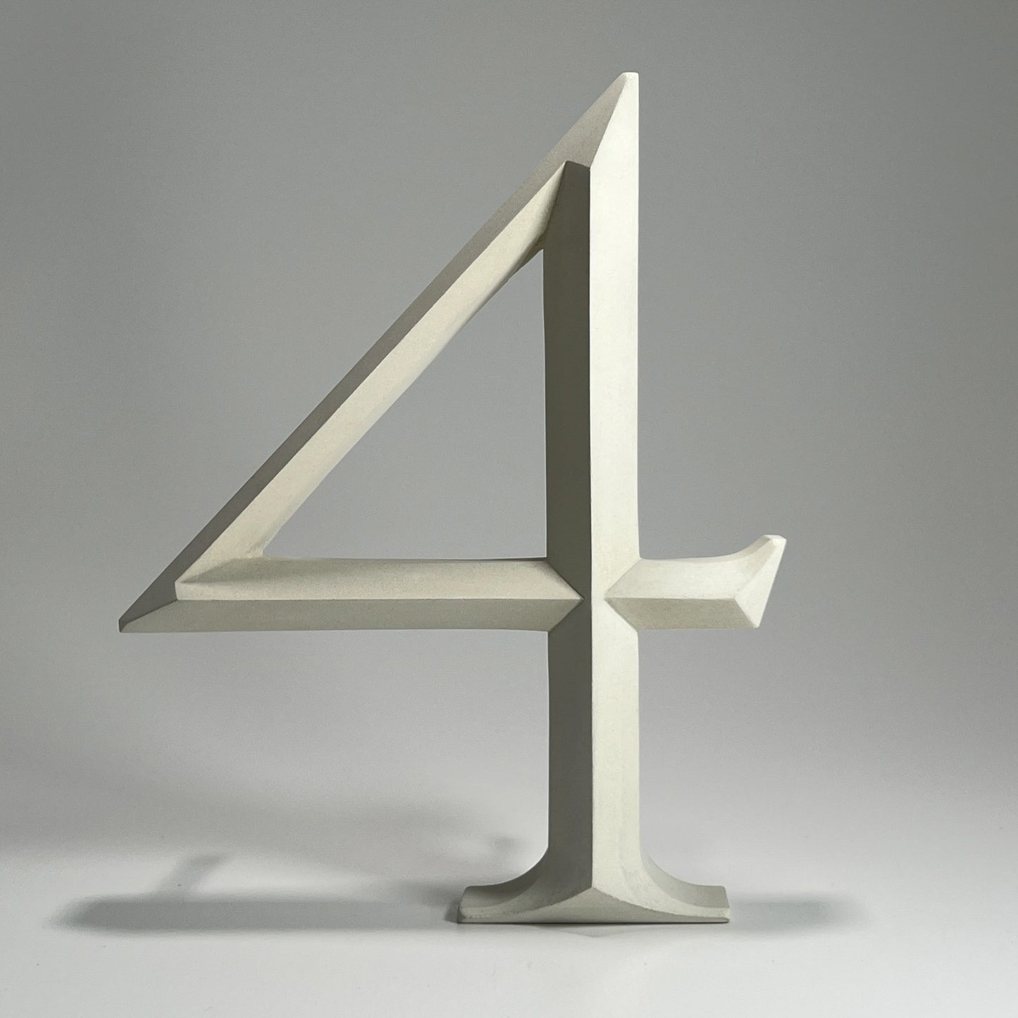 Elegant floating prismatic house number ‘4’, suitable for luxury homes and timeless architectural designs.