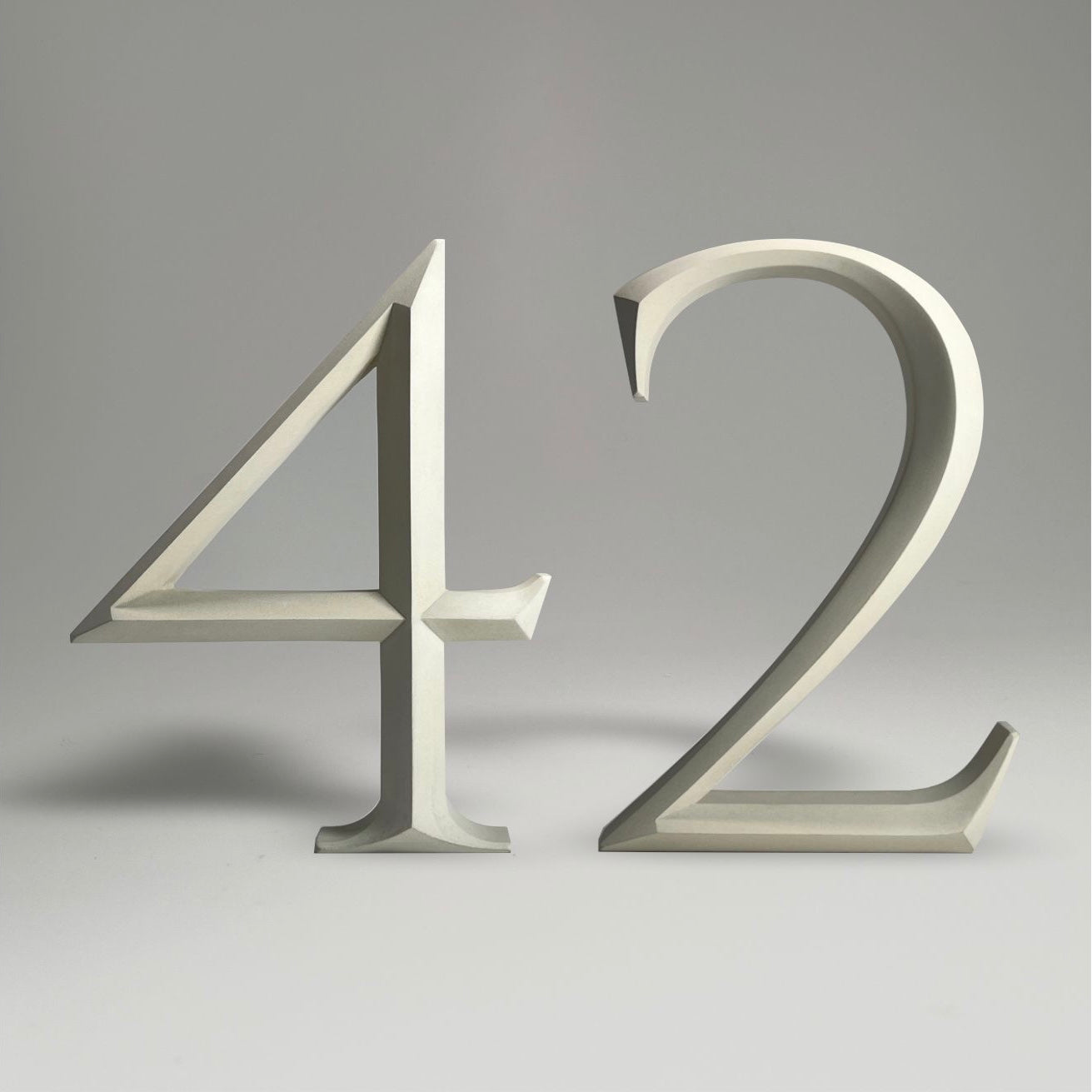 Luxury floating prismatic house number sign ‘42’, ideal for classical houses with timeless appeal.