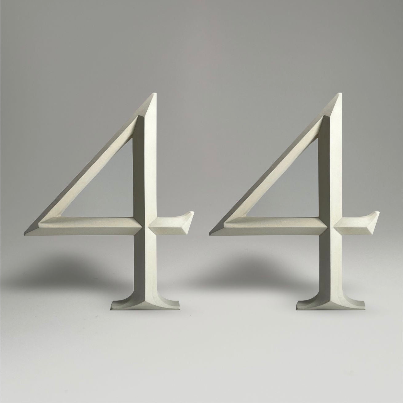 Elegant floating prismatic house number ‘44’, suitable for luxury homes and timeless architectural designs.