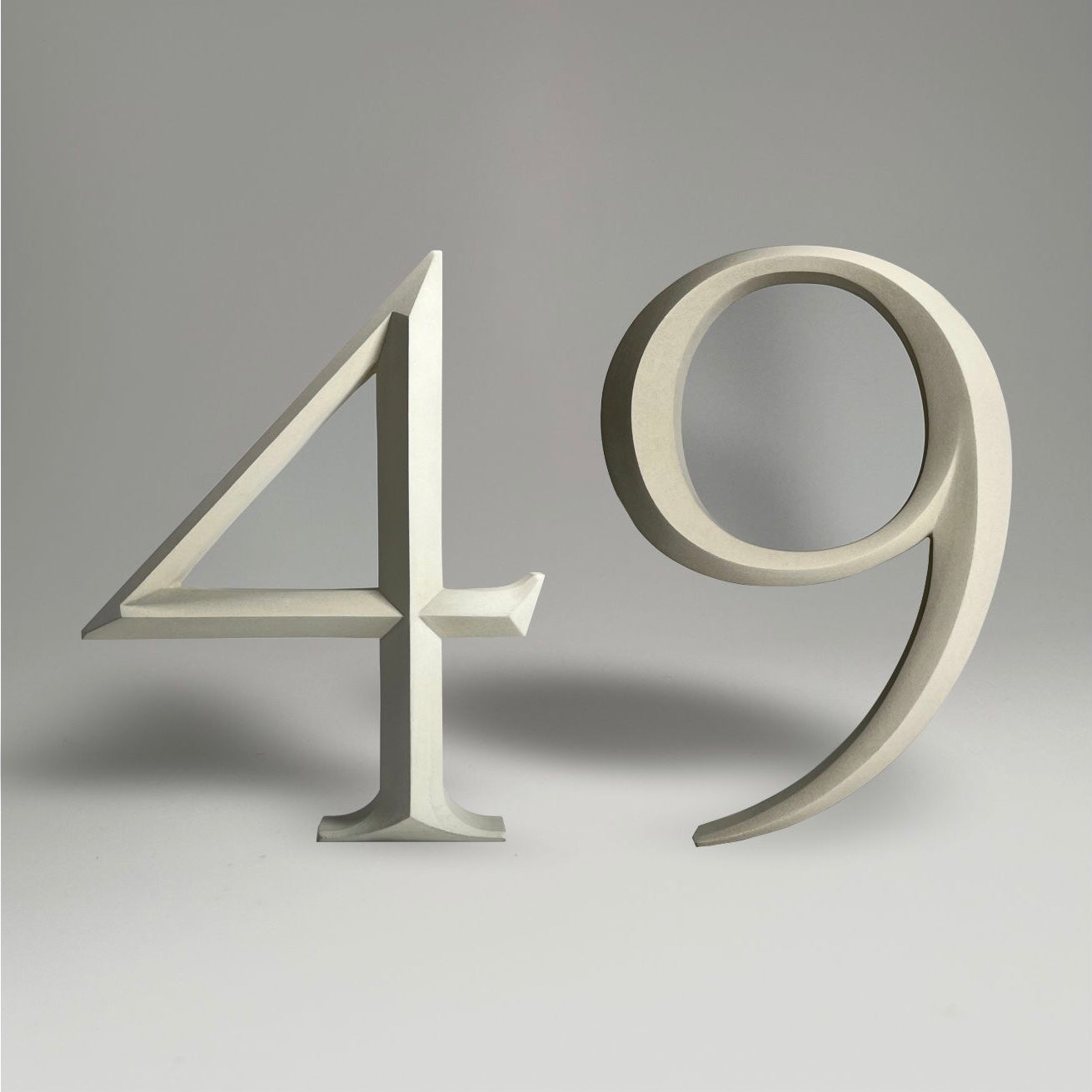 Elegant floating prismatic house number ‘49’, suitable for luxury homes and timeless architectural designs.
