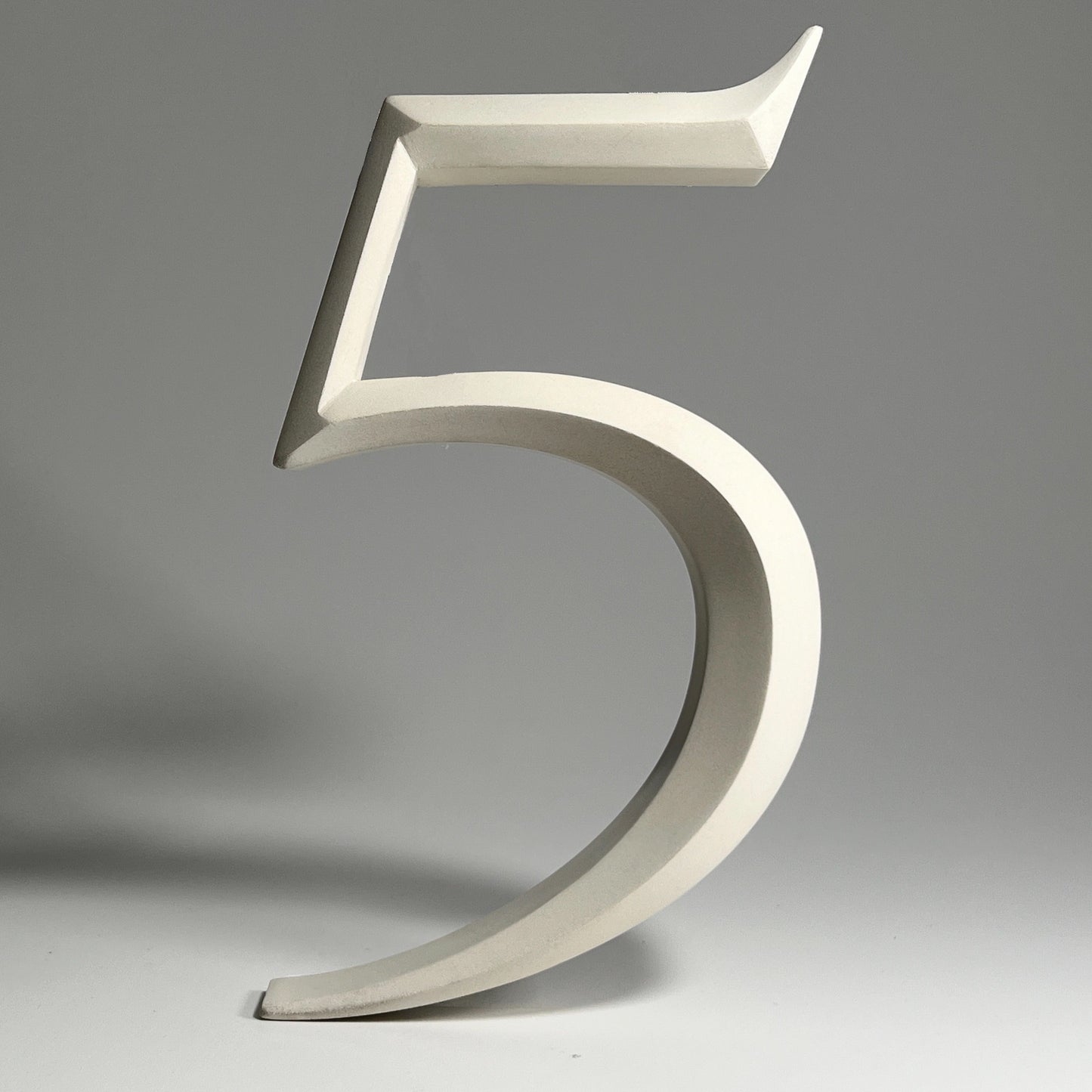 Elegant floating prismatic house number ‘5’, suitable for luxury homes and timeless architectural designs.