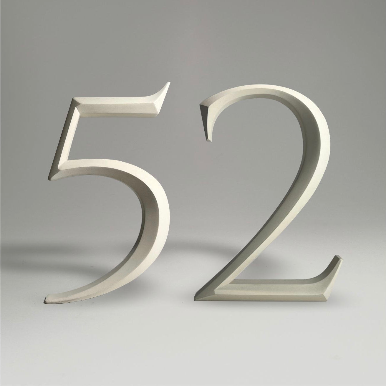Luxury floating prismatic house number sign ‘52’, ideal for classical houses with timeless appeal.