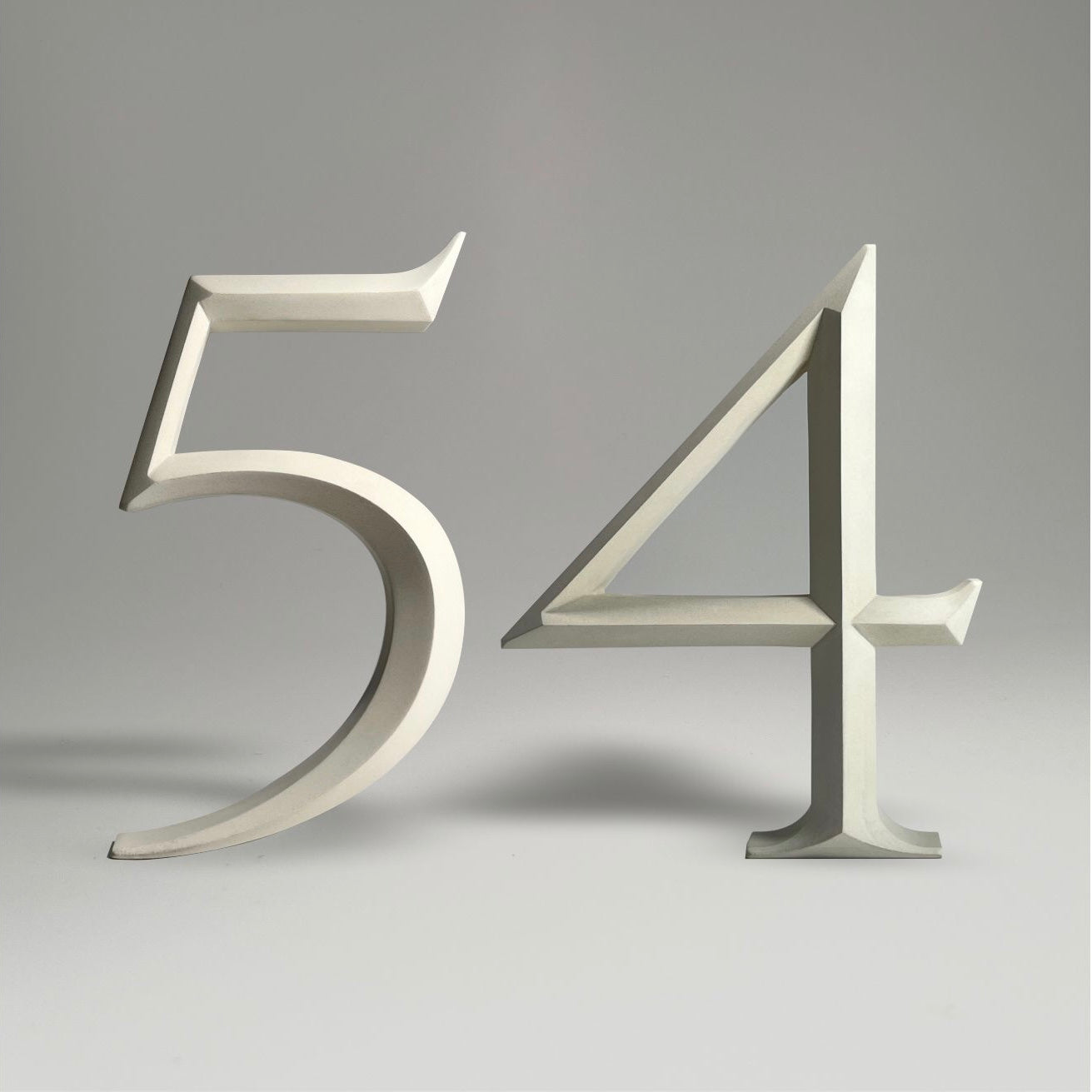 Elegant floating prismatic house number ‘54’, suitable for luxury homes and timeless architectural designs.