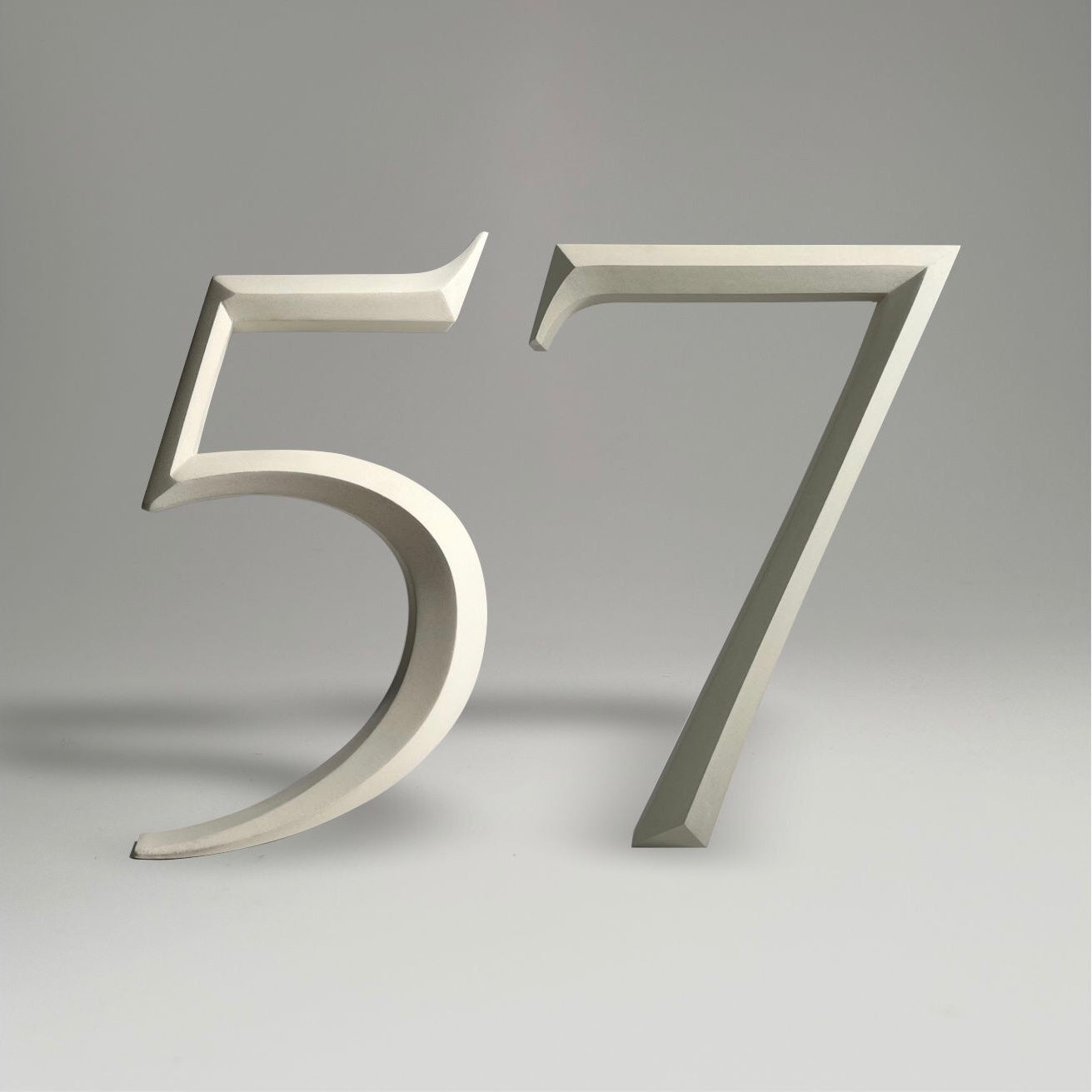 Luxury floating prismatic house number sign ‘57’, ideal for classical houses with timeless appeal.