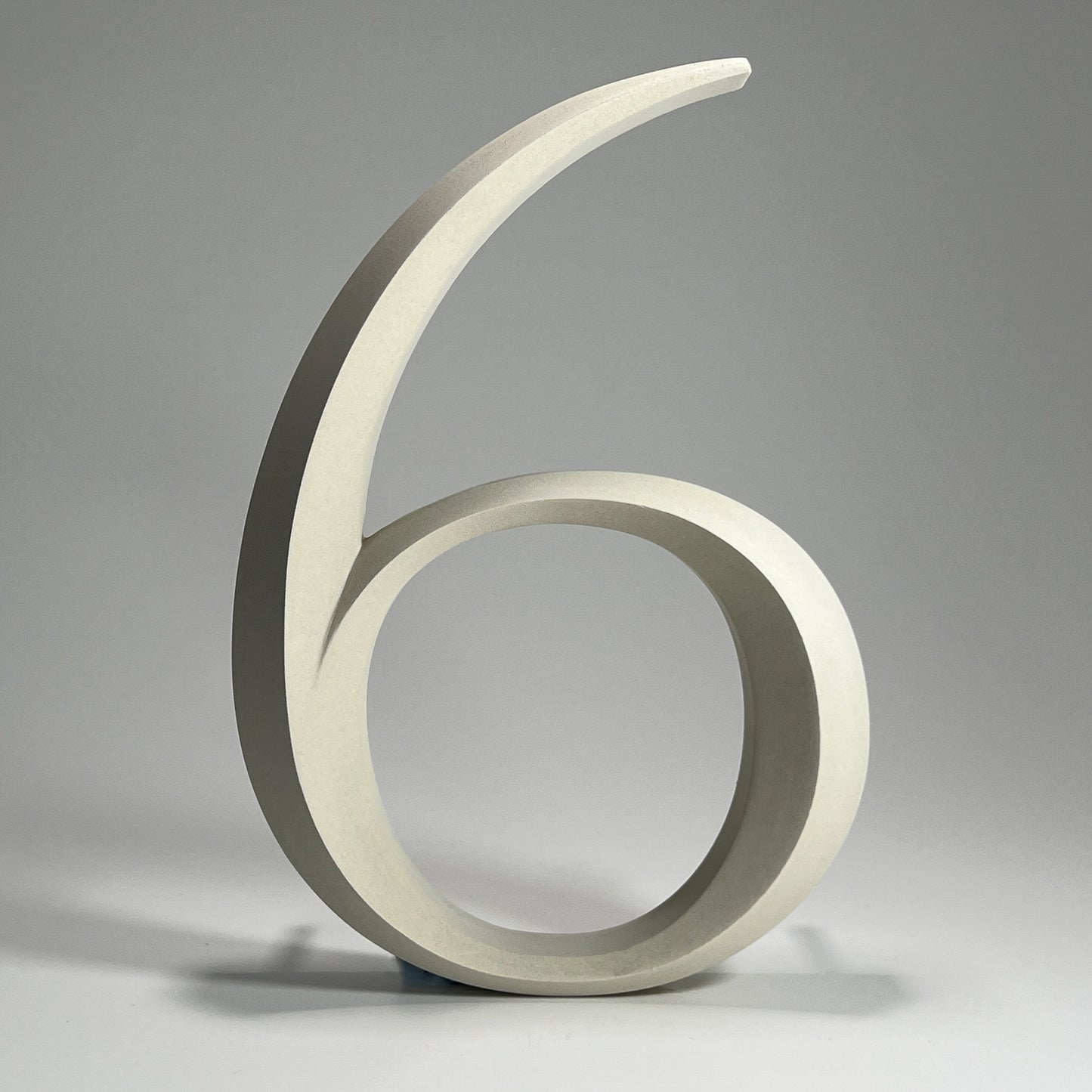 Elegant floating prismatic house number ‘6’, suitable for luxury homes and timeless architectural designs.