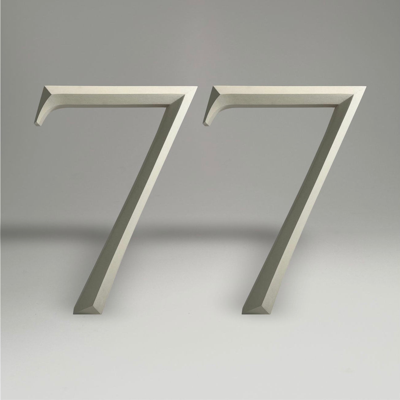 Luxury floating prismatic house number sign ‘77’, ideal for classical houses with timeless appeal.