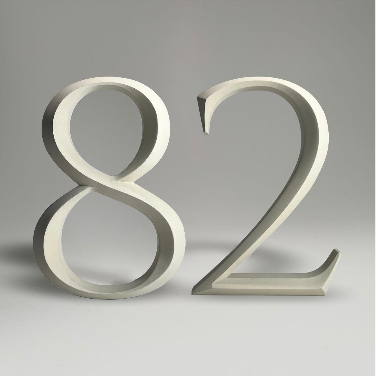 Luxury floating prismatic house number sign ‘82’, ideal for classical houses with timeless appeal.