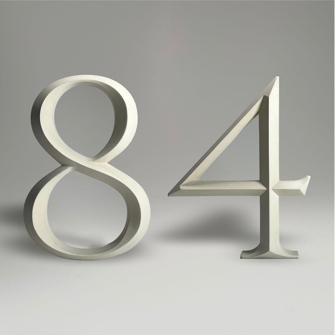 Elegant floating prismatic house number ‘84’, suitable for luxury homes and timeless architectural designs.
