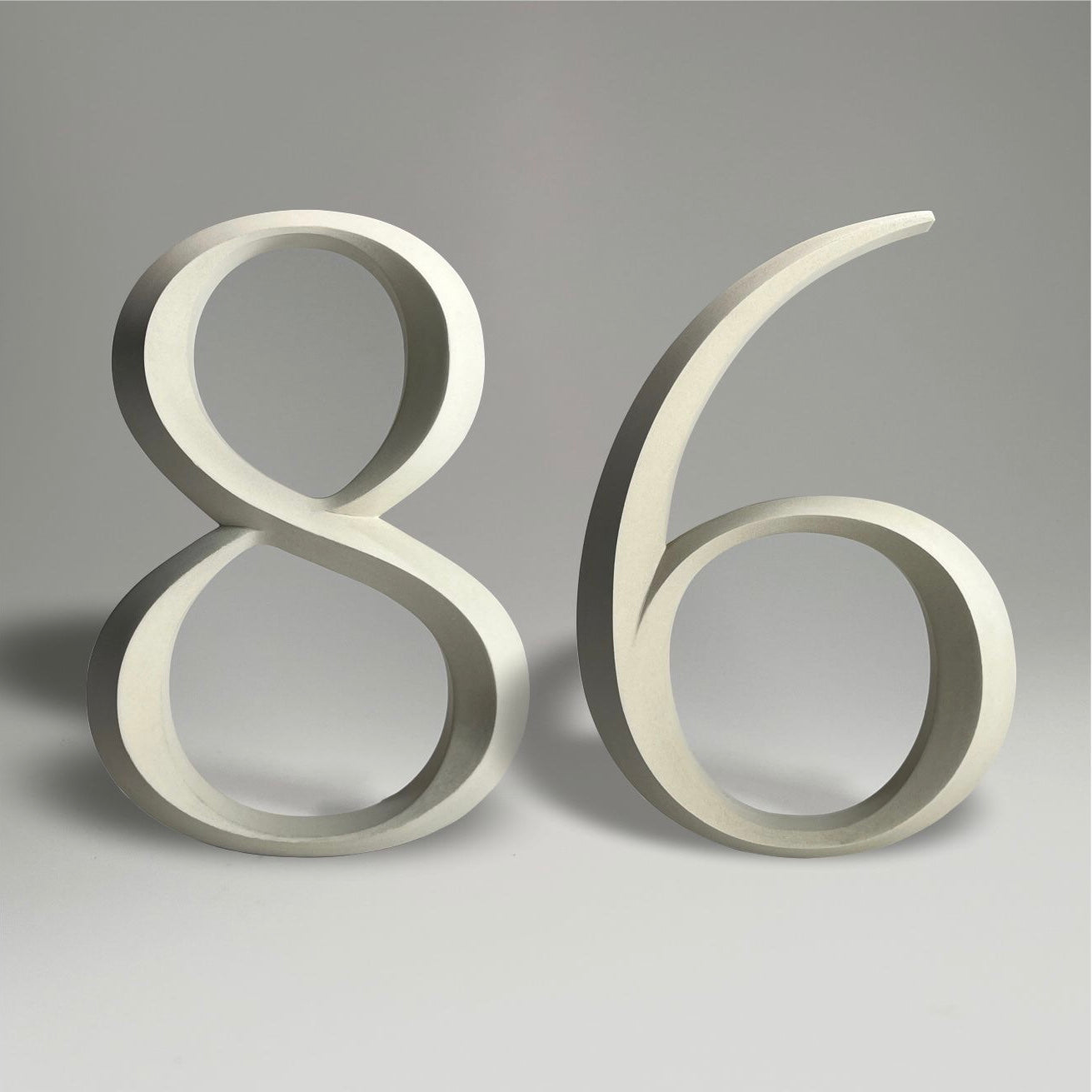 Floating prismatic house number ‘86’ with a sleek design, crafted for elegant homes and modern house signs.