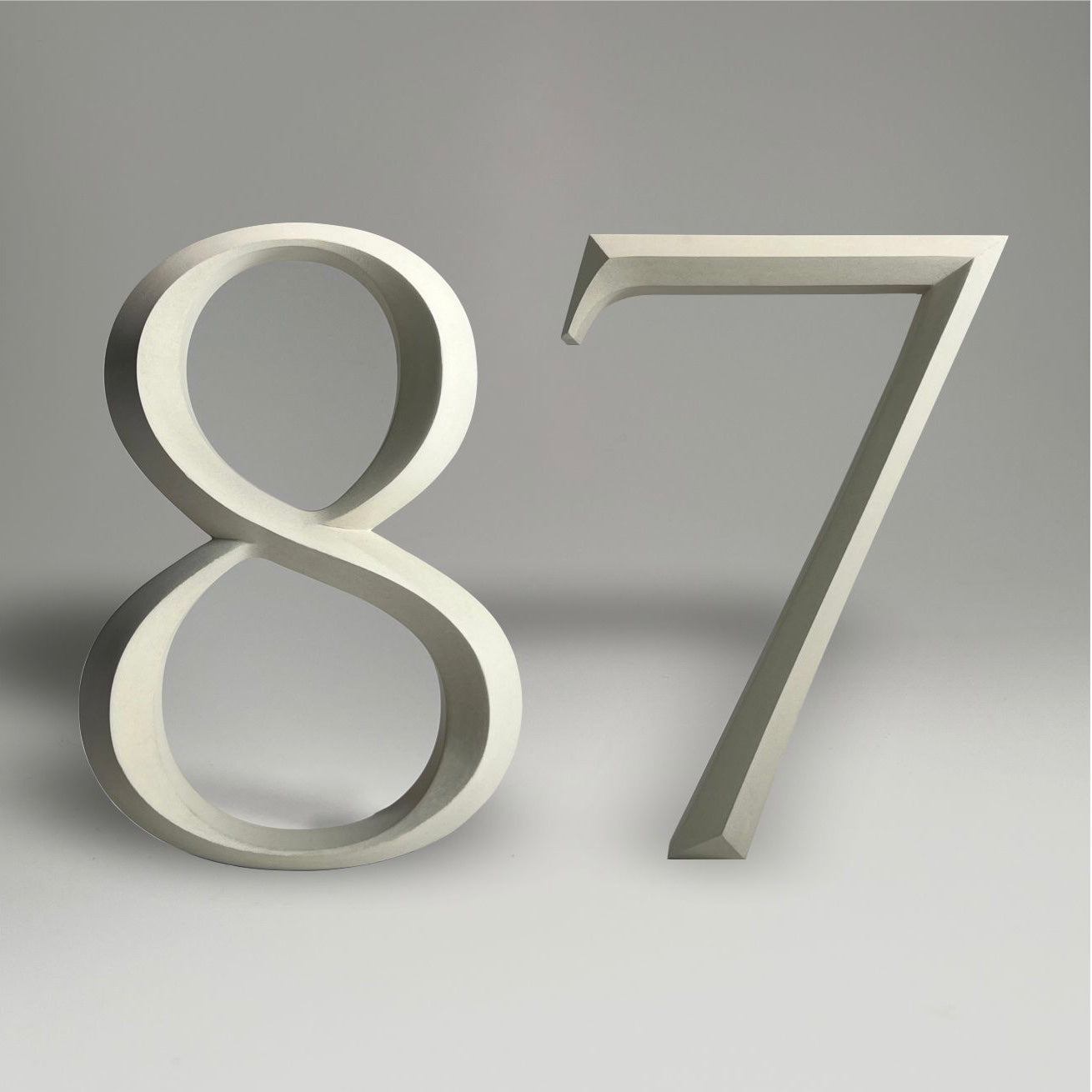 Luxury floating prismatic house number sign ‘87’, ideal for classical houses with timeless appeal.