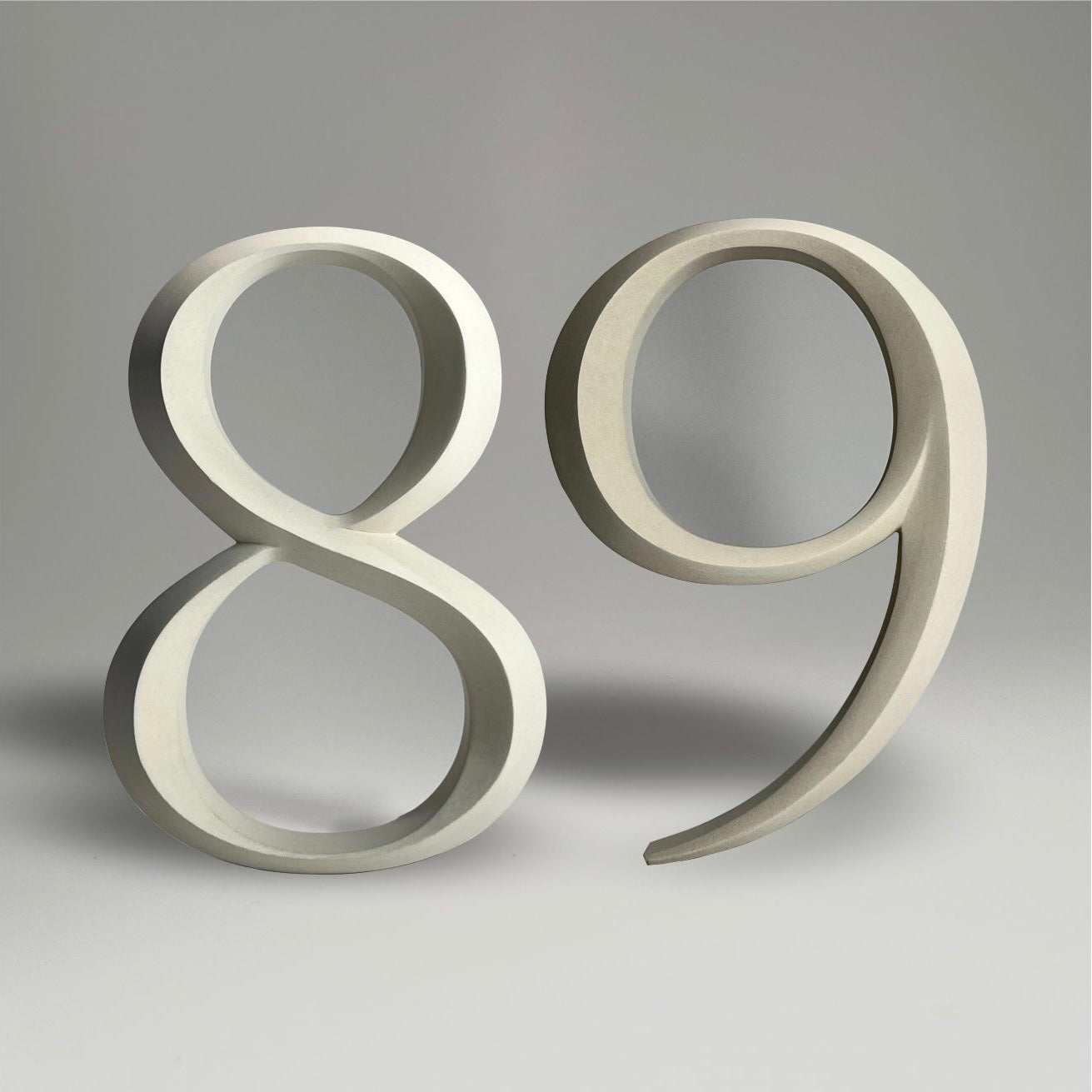 Elegant floating prismatic house number ‘89’, suitable for luxury homes and timeless architectural designs.
