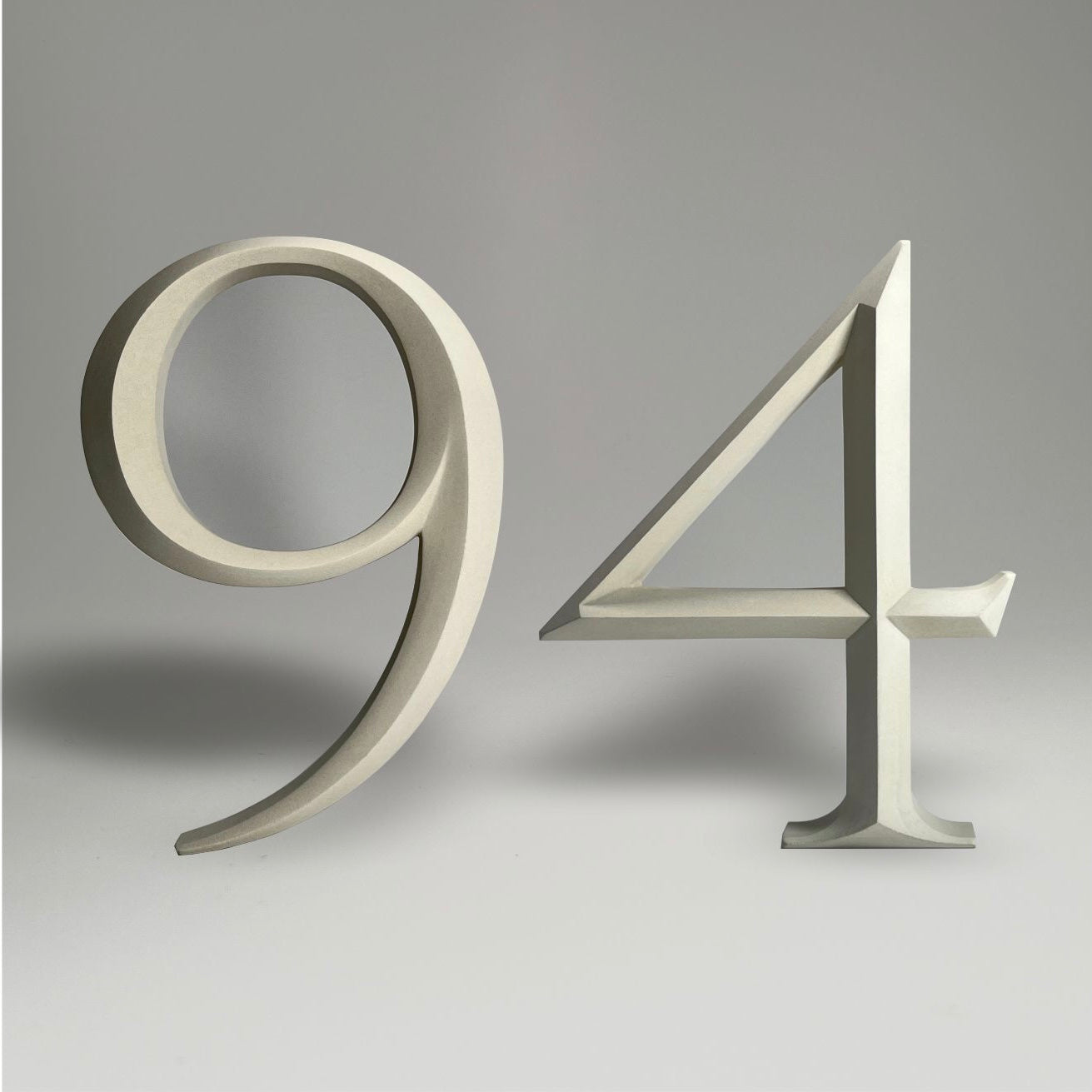 Elegant floating prismatic house number ‘94’, suitable for luxury homes and timeless architectural designs.
