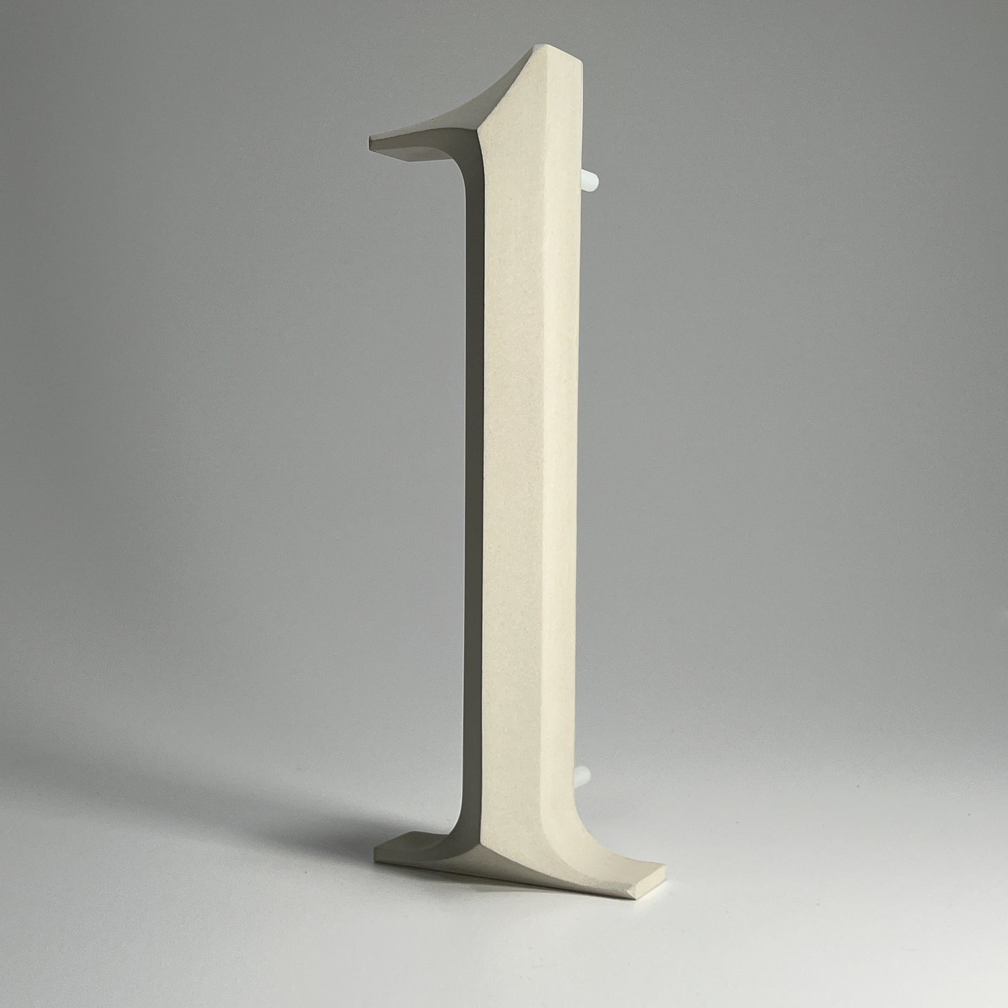 Elegant floating prismatic house number ‘1’, suitable for luxury homes and timeless architectural designs.