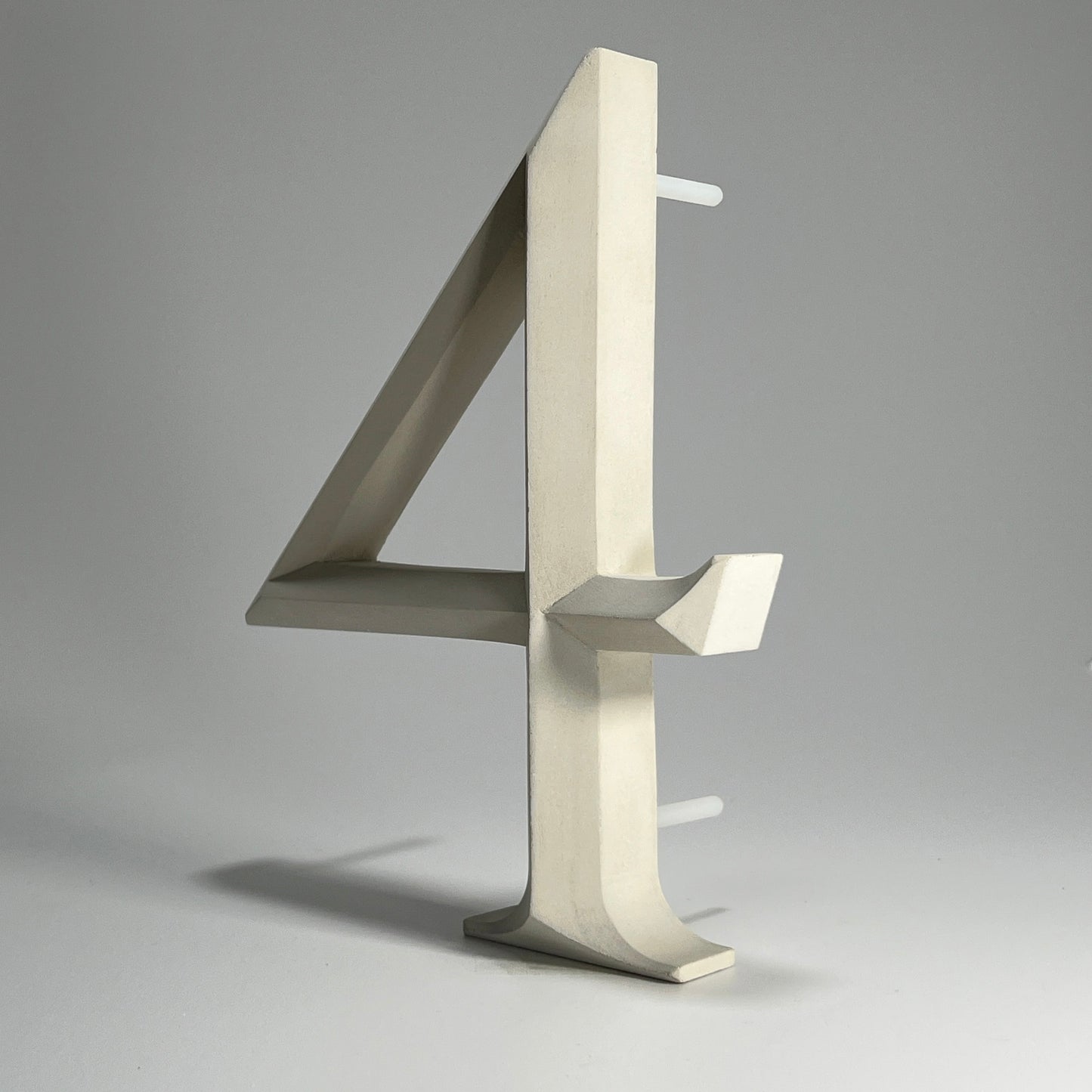 Luxury house number ‘4’, with a floating prismatic design for modern and classical homes alike.