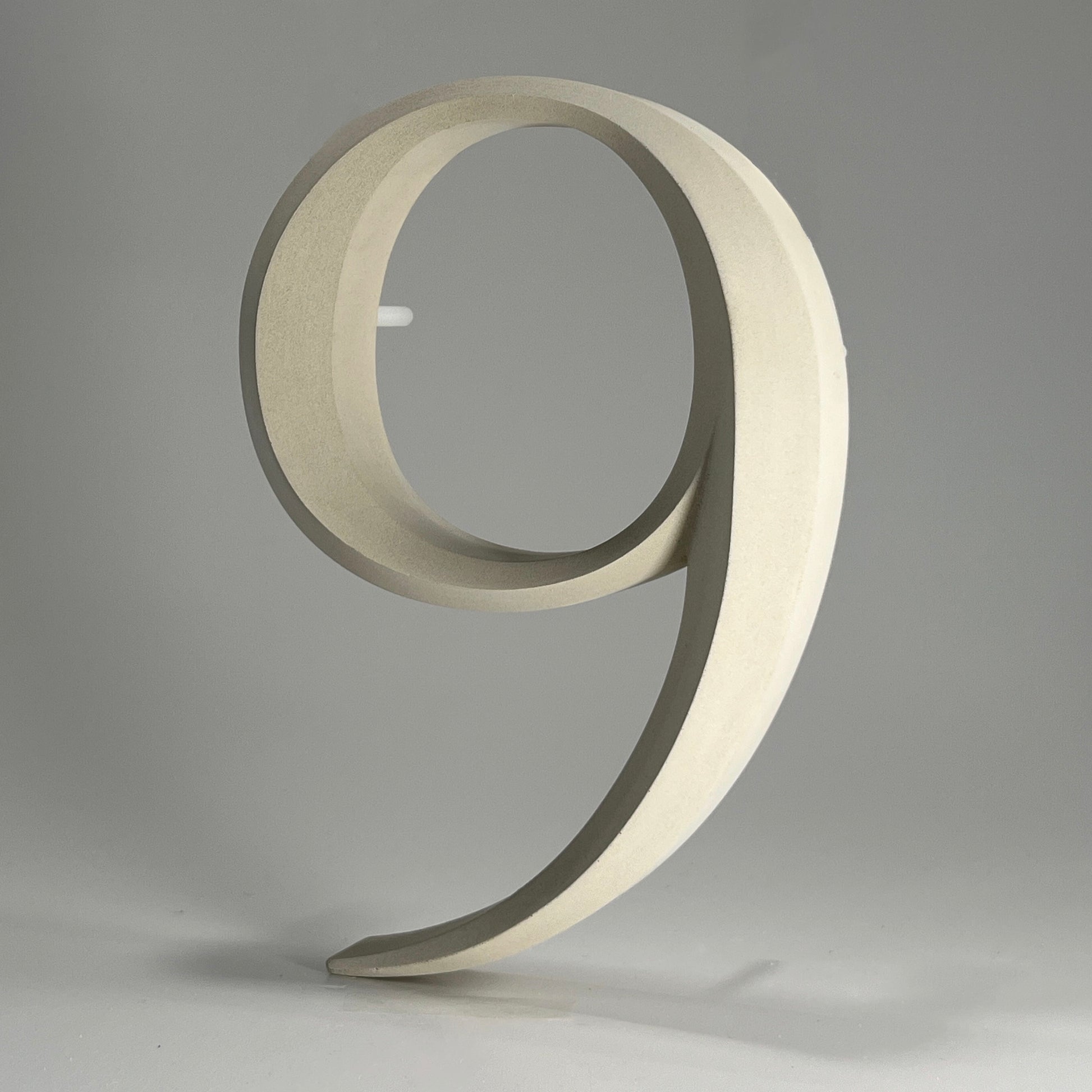 Floating prismatic house number ‘9’, crafted in an elegant design, perfect for modern homes and house signs.